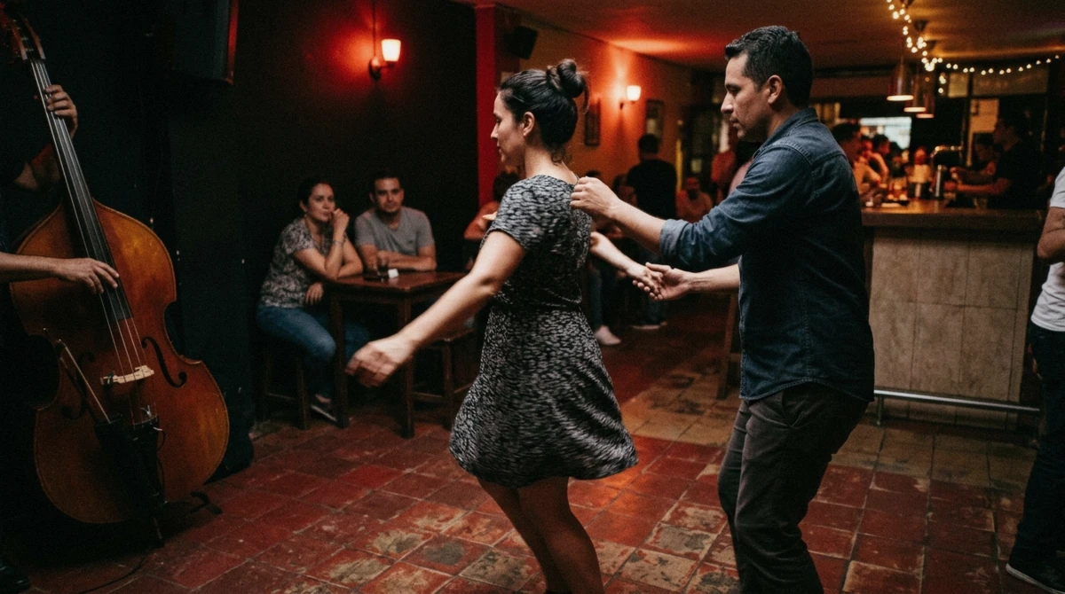 Couples dancing salsa on a crowded dance floor in Laureles, part of the best area for nightlife in Medellin outside El Poblado