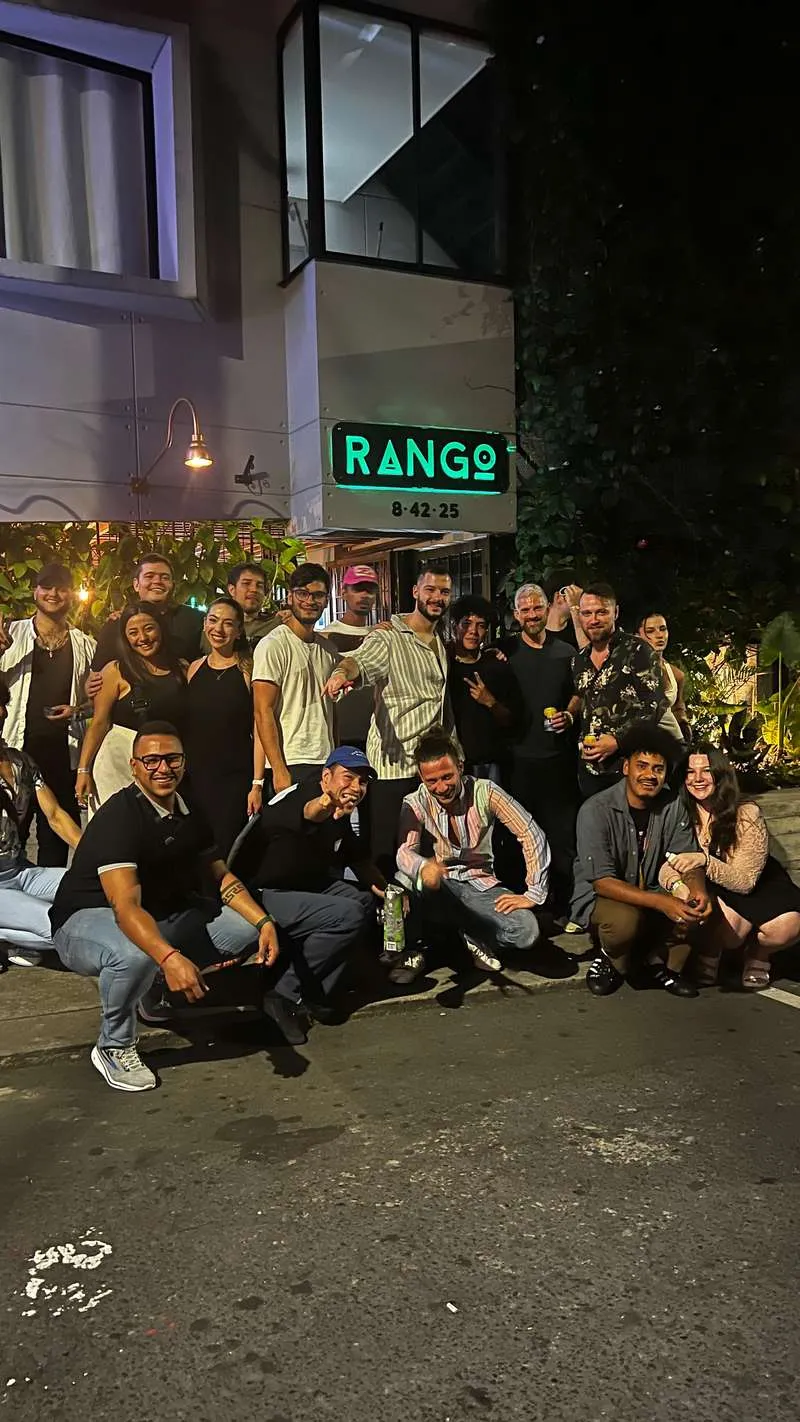 Travellers socialising at an authentic Medellin Colombia nightlife bar off the tourist trail during a local-led nightlife tour